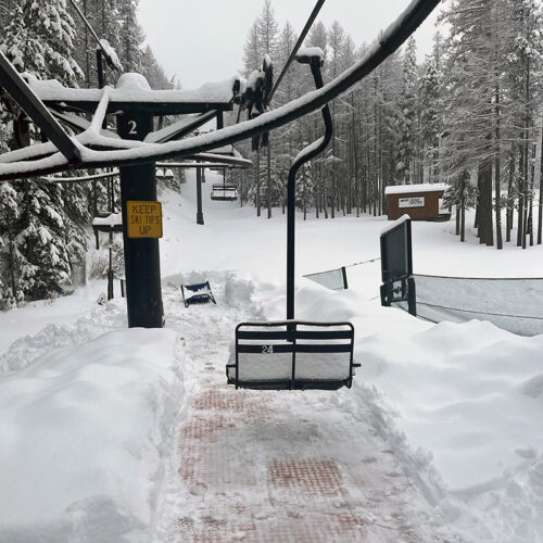 Snow covered Riblett chair at the bottom of Chair 3 at Mission Ridge