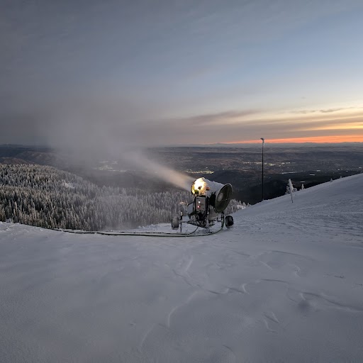 Snow gun firing near the summit of Mission Ridge just before sunrise.