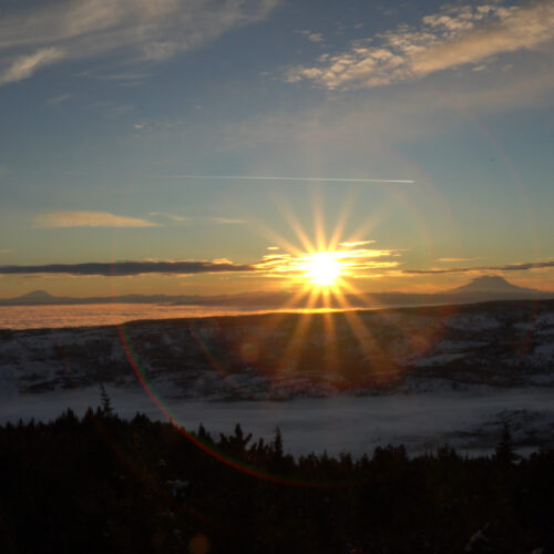 Sunset behind Mt. Rainier and Mt. Adams as see from the summit of Mission Ridge.