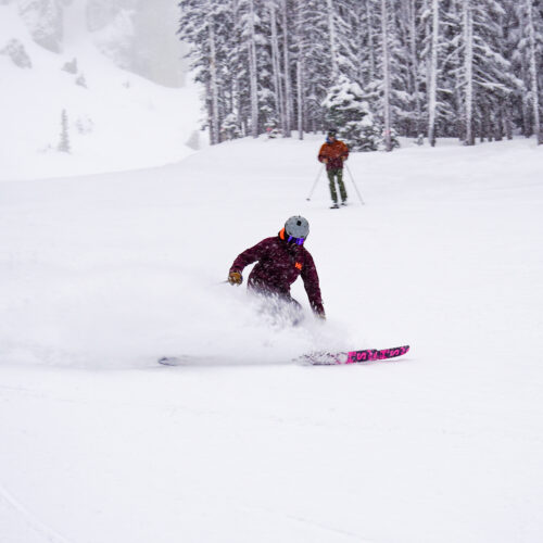 Skier making powder turn at Mission Ridge