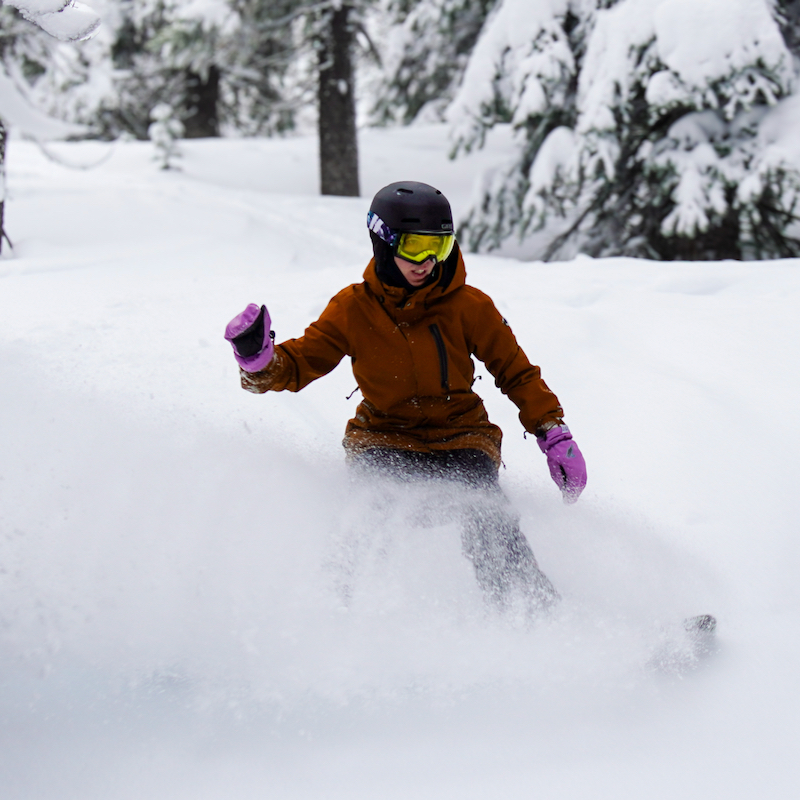 A snowboarder descends the trees to the skier's left of Lemon ski trail at Mission Ridge.