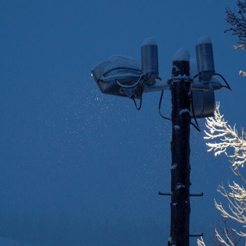 A floodlight shining during night skiing with the sky as the backdrop at Mission Ridge