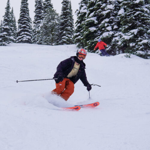 Skiier with some pow turns